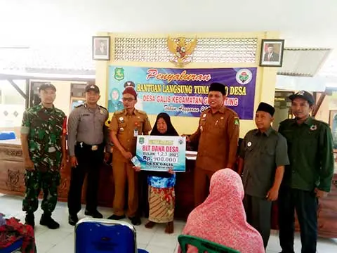 Penyerahan Secara Simbolis Oleh Koramil, Kapolsek Camat, Kades, Ketua BPD dan Pendamping Desa