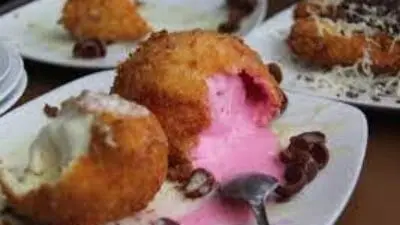 Delight your taste buds with this crispy and refreshing fried ice cream, made effortlessly with sliced bread and your favorite ice cream flavor. Perfect for a quick dessert or a creative treat to sell